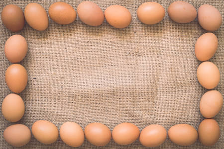 Eggs on old crumpled burlap, Backgroundの写真素材