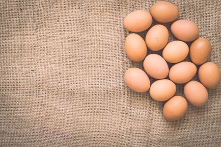 Eggs on old crumpled burlap, Background