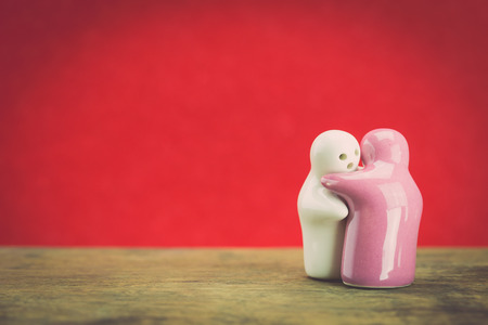 Two ceramic doll on wood, With retro filter effectの写真素材