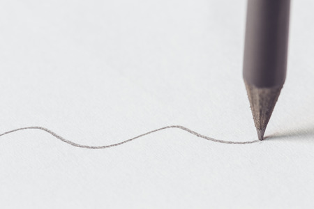 Close up Black pencil with stroke on white paperの写真素材
