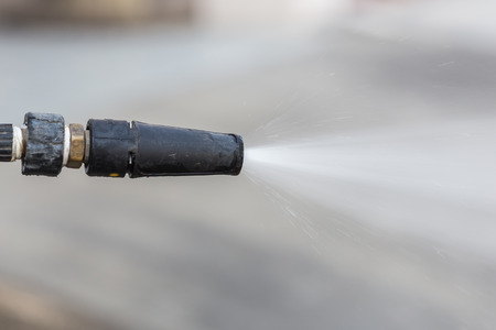 Close up Outdoor floor cleaning with high pressure water jetの写真素材