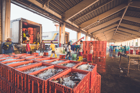 PHUKET - MARCH 10 : Burmese people are working in fish market at Phuket province, Which mostly labor work in this market come from Myanmar on March 10, 2015 in Phuket, Thailand.のeditorial素材