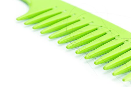Close up Green comb with hair, Hair Loss conceptの写真素材