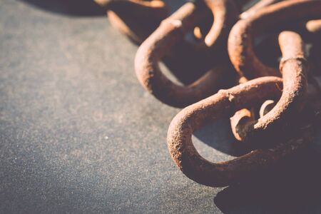 Macro Old and rusty chain on black background