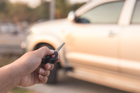 Close up Hand holding car keyの写真素材