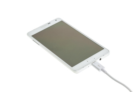 Macro Smartphone connect with charger isolated on white 