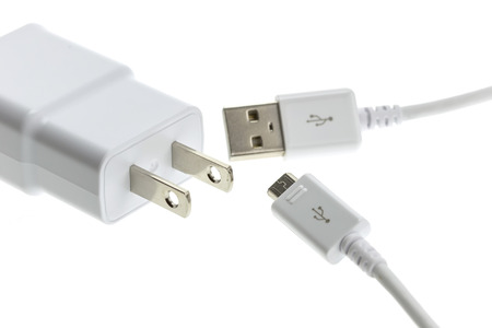 Macro White mobile charger isolated on white background