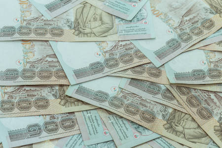 Close up stack of Thai money in one thousand type banknotes