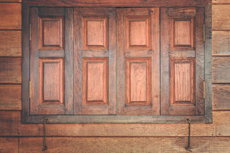Close up brown wooden window and wall texture backgroundの写真素材