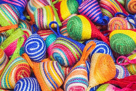 Close up stack of colorful handmade coin bag in market, Thailandの写真素材