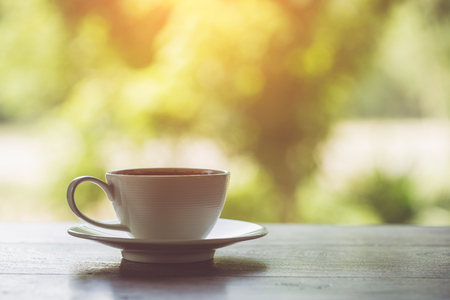 Close up white coffee cup on the table at morning timeの写真素材