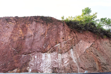 Texture of mountain showing red soil after excavated to build the road