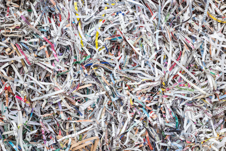 Close up stack of scrap paper from paper cutter for backgroundの写真素材