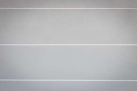 Abstract bright grey cement wall with white stripe texture and backgroundの写真素材