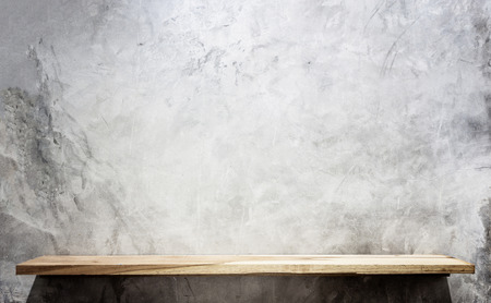 Empty top wooden shelves and stone wall background. For product displayの写真素材