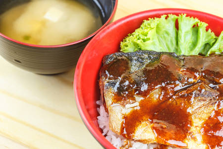 Traditional japanese food, Saba teriyaki serve with rice and soup on wooden tableの写真素材