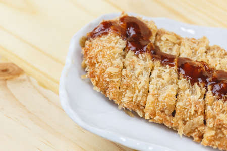 Traditional japanese food, Fried pork (Tonkatsu) on wooden tableの写真素材