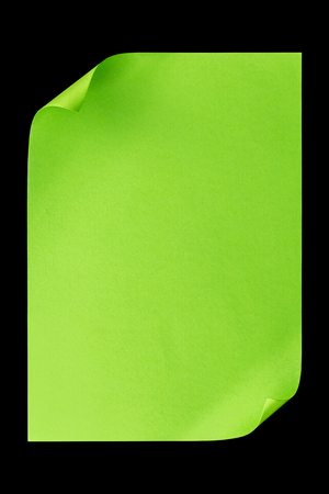 Green empty A4 paper isolated on black backgroundの写真素材