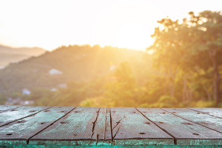 Empty top wooden table and sunny abstract blurred bokeh backgroundの写真素材