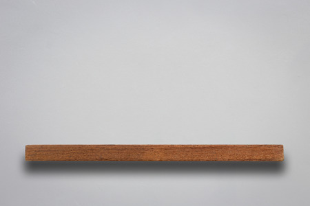 Empty wooden shelves and stone wall background. For product displayの写真素材