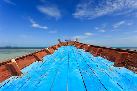 Front of traditional Thai boat and view of tropical sea with blue skyの写真素材