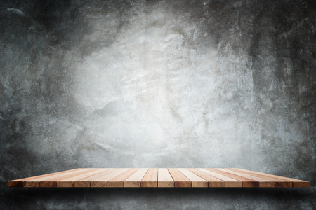 Empty top wooden shelves and stone wall background. For product displayの写真素材