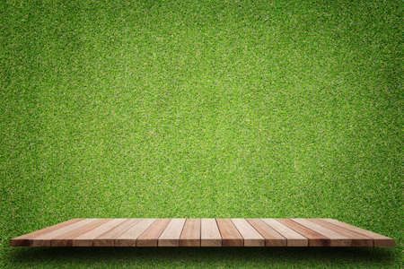 Empty top of wooden shelves and green pattern wall background. For product displayの写真素材