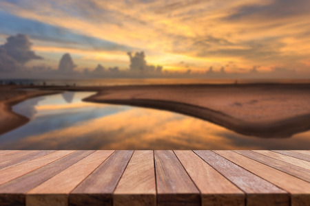 Empty top of wooden table and view of sunset or sunrise background. For product displayの写真素材