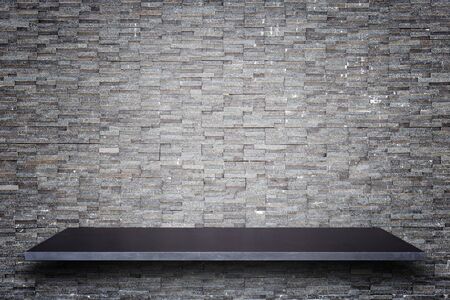 Empty top of natural stone shelves and stone wall background. For product displayの写真素材