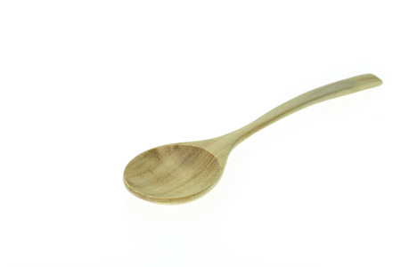 Close up wooden  spoon isolated on white backgroundの写真素材