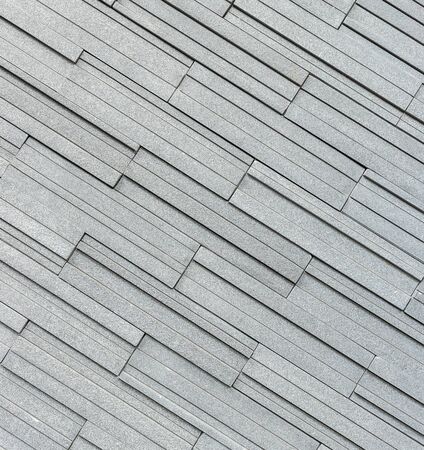 Pattern of grey and rough granite wall texture and background
