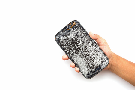 Hand holding broken smart phone isolated on white backgroundの写真素材
