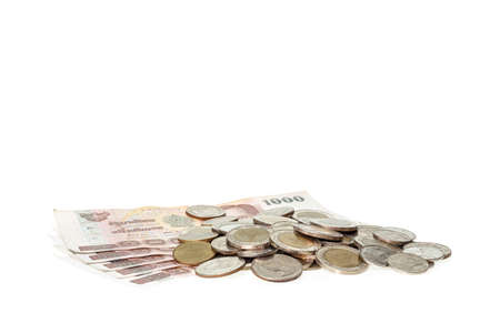 Close up pile of Thai money isolated on white background