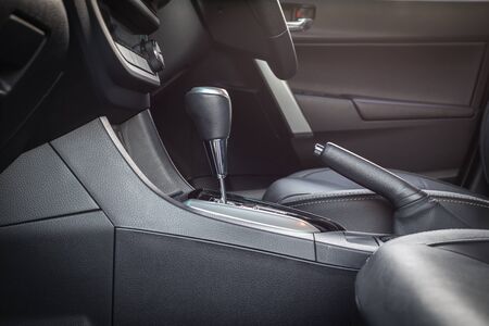 Detail of new modern car interior, Focus on hand break