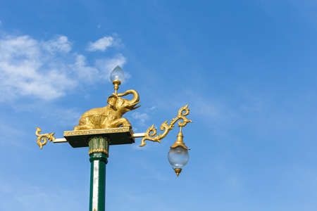 Traditional Thai style light pole with elephant statue on blue sky backgroundの写真素材