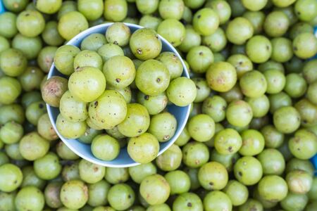 Top view local Thai green gooseberry fruit in Chiang Mai market, Thailandの写真素材
