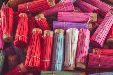 Close up stack of colorful handmade umbrella in Chiang Mai province, Thailandの写真素材