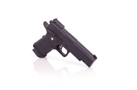 Close up black gun isolated on white backgroundの写真素材