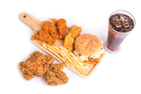 Close up fried chicken, french fries and soft drink on wooden tableの写真素材
