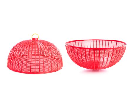 Red plastic mesh cover (used to cover food to protect from insects) isolated on white backgroundの写真素材