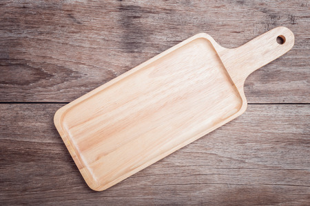 Close up empty flat wooden tray on wooden table top view