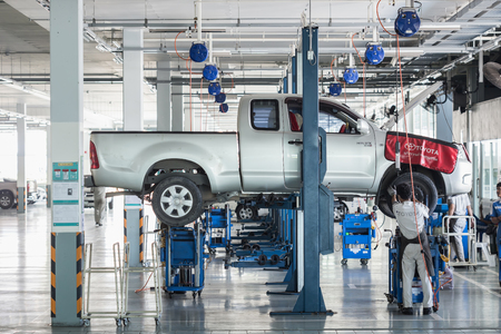 PHUKET, THAILAND - APRIL 19 : Car technician repairing car in workshop service station in Phuket on March 19, 2016. The official dealer of Toyota, who is the top market share for commercial car.のeditorial素材