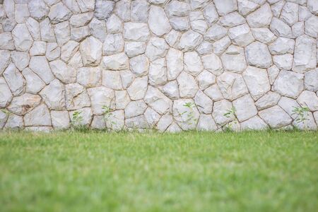 Exterior natural stone wall decorative in the gardenの写真素材