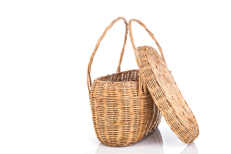 Close up handmade rattan basket isolated on white backgroundの写真素材