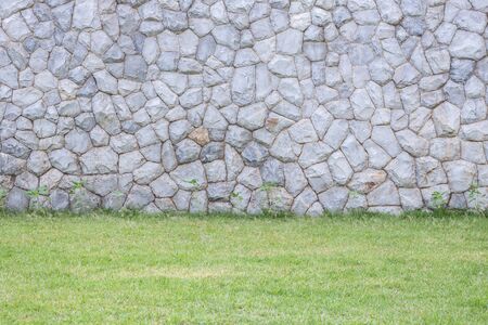 Exterior natural stone wall decorative in the gardenの写真素材