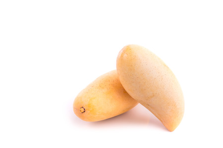 Close up yellow Thai mango isolated on white backgroundの写真素材