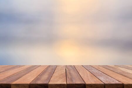 Empty top of wooden table and nature abstract blurred background. Can use for product displayの写真素材