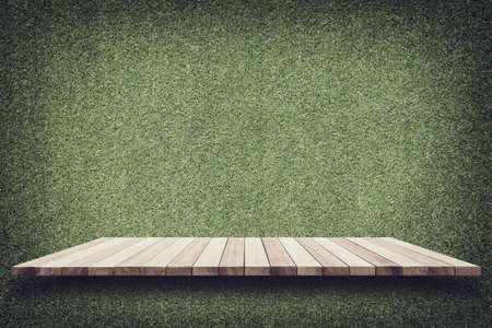 Empty top of wooden shelves and green pattern wall background. For product displayの写真素材