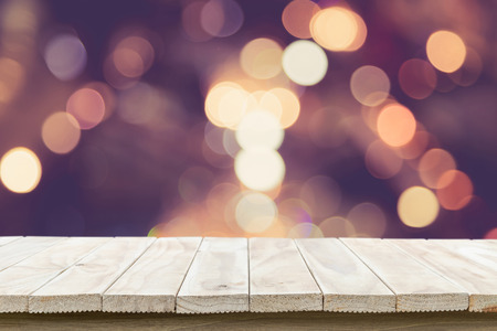 Empty top wooden table and sunny abstract blurred bokeh background. Can use for product displayの写真素材