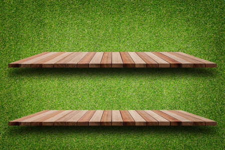 Empty top of wooden shelves and green pattern wall background. For product displayの写真素材